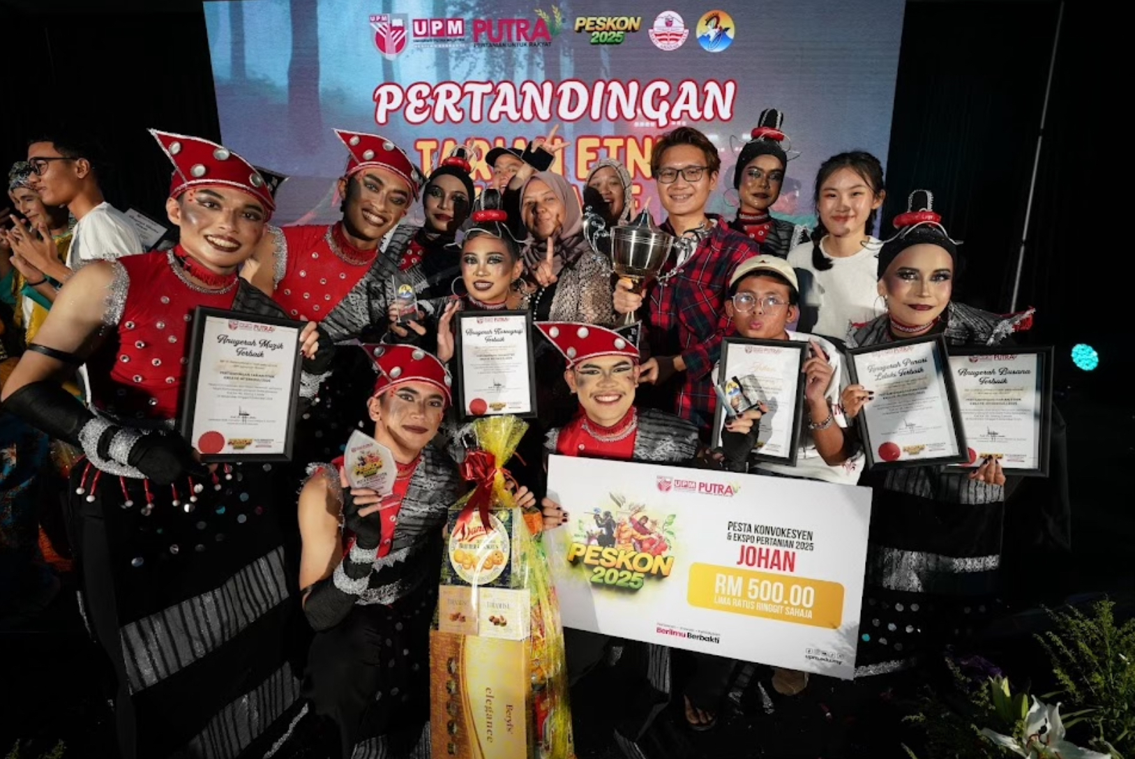 Photo 4: A group photo of winners, coaches, and supporters